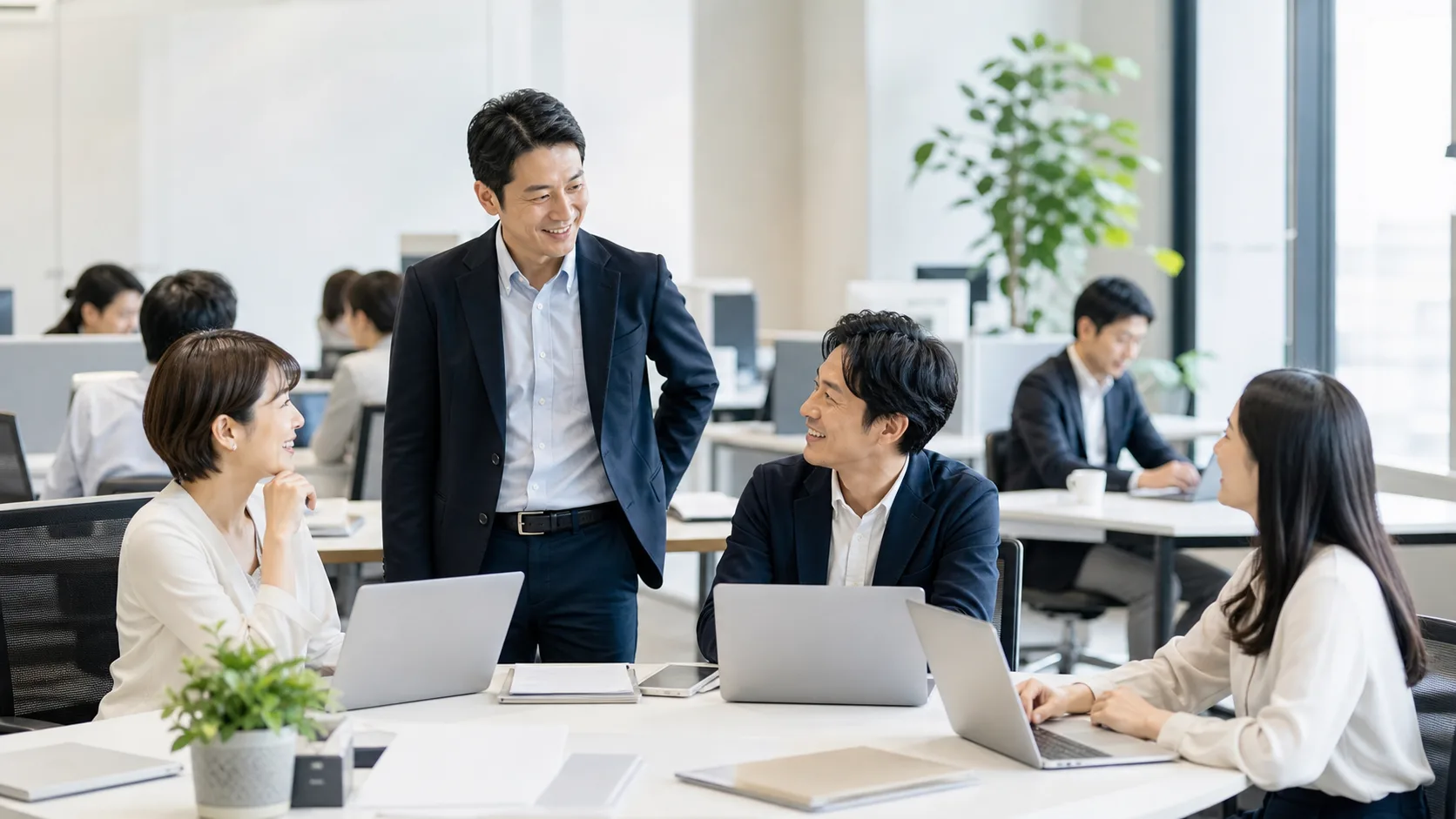 会社売却後の従業員・社員・役員の雇用と処遇を表すオフィスシーン